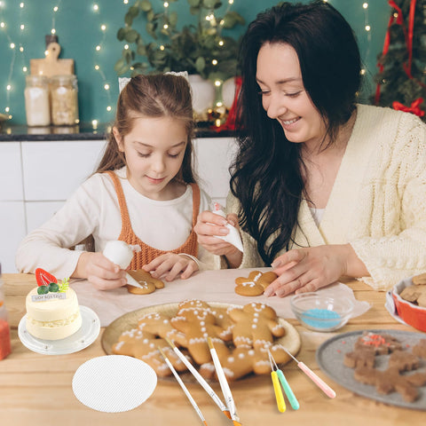 Uso navidad Pimoys para decorar galletas festivas.