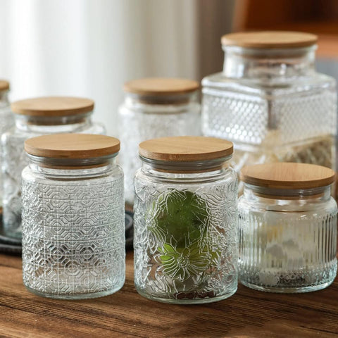 Organizador de cocina con frascos de vidrio Prettidecor para mantener la encimera limpia.