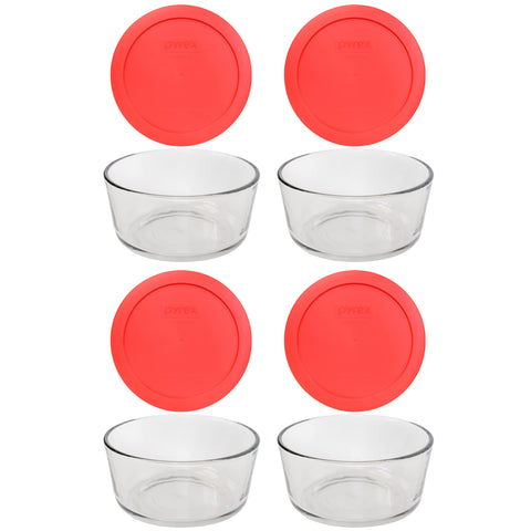 Plato de vidrio Pyrex con tapa roja, ideal para almacenar y recalentar comidas.
