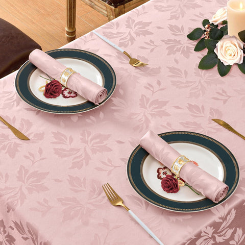 Mantel rosa impermeable, fácil de limpiar durante fiestas.