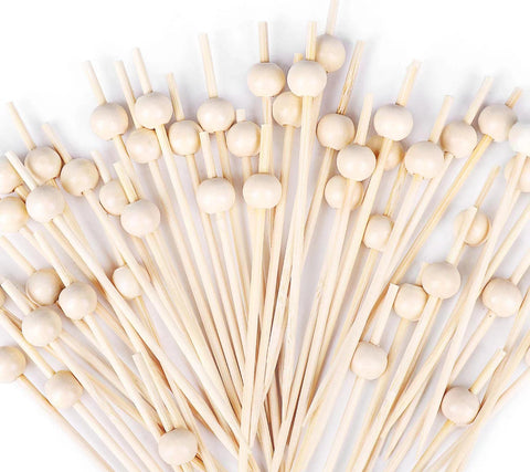 Pinchos SEANSDA con perla de madera para decorar cócteles y aperitivos.