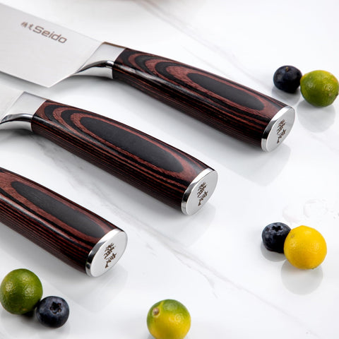 Seido Knives: mango ergonómico de pakkawood para control cómodo durante la preparación.