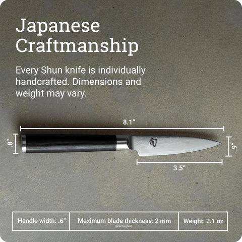 Shun Classic cuchillo para frutas y verduras pequeñas con control detallado.