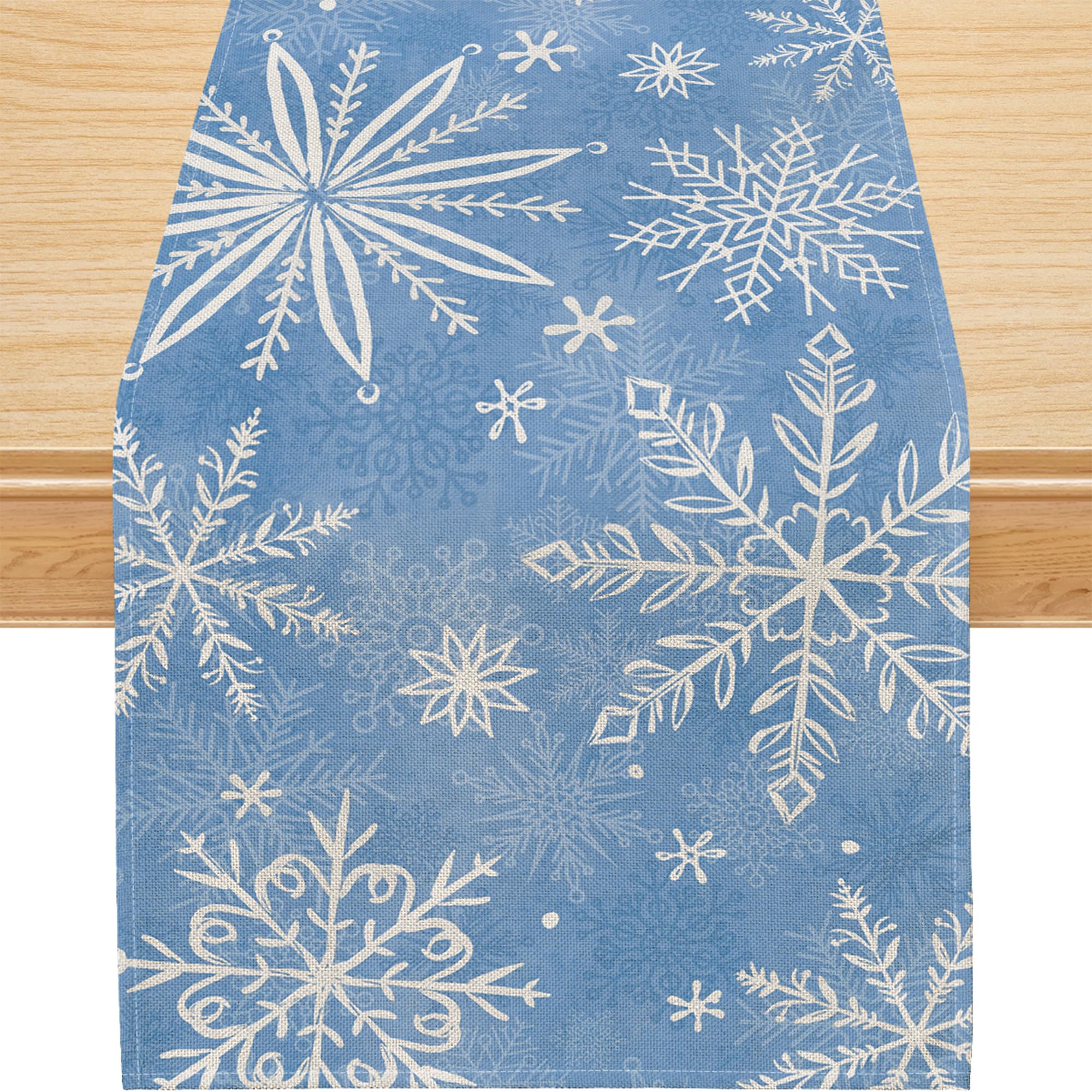 Mantel Siilues azul con copos de nieve, ideal para fiestas.