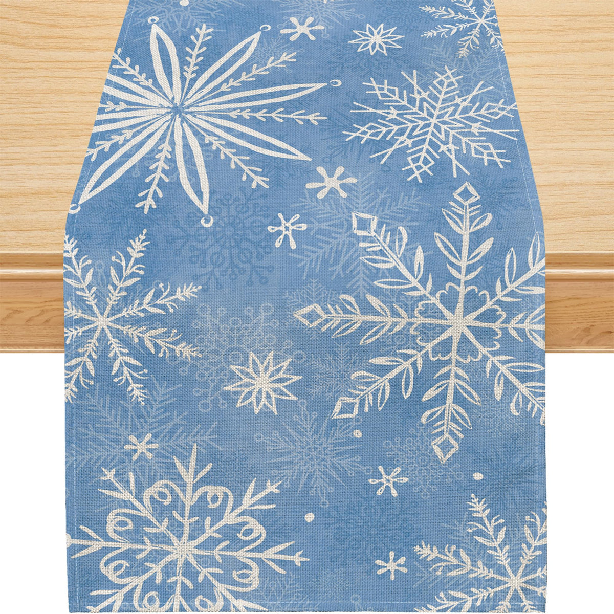 Mantel Siilues azul con copos de nieve, ideal para fiestas.