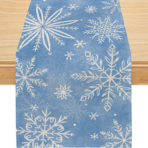Mantel Siilues azul con copos de nieve, ideal para fiestas.