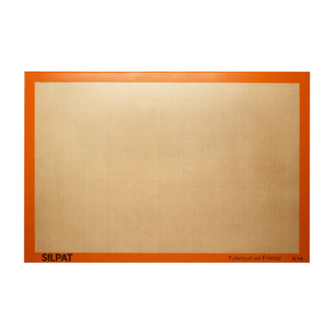 Silpat mat de horneado original en uso, antiadherente para hornear sin esfuerzo.