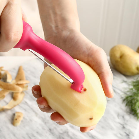 Spring Chef pelador rosado ergonómico para uso cómodo, diestros y zurdos.