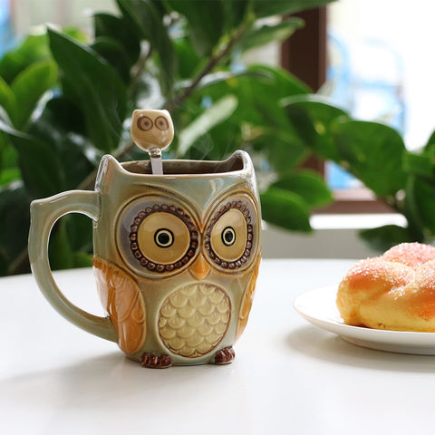 Taza cerámica SQOWL de 12 oz en color cian, perfecta para café o té.