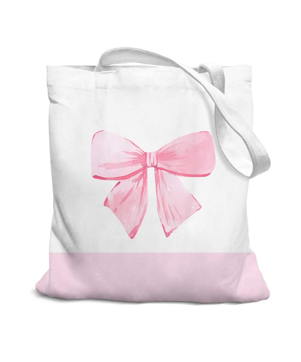 SZERE Coquette con lazo rosa en tote de canvas, ideal para completar un estilo elegante y juvenil.