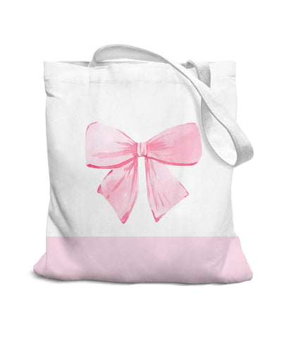 SZERE Coquette con lazo rosa en tote de canvas, ideal para completar un estilo elegante y juvenil.