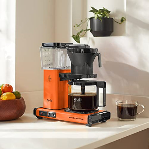 Technivorm Moccamaster cafetera naranja diseño elegante para cocinas modernas.