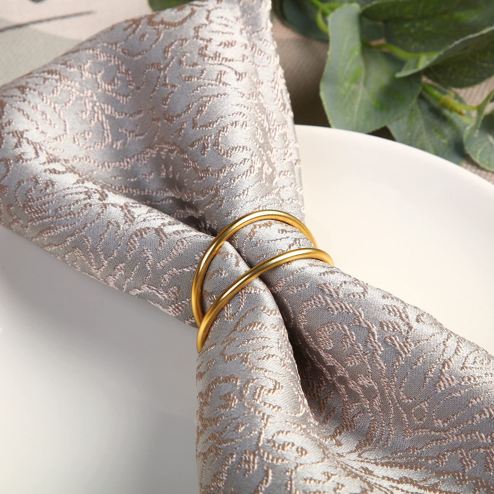 TecUnite servilleta dorado con acabado brillante para un look de mesa sofisticado.