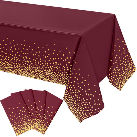 Mantel Tegeme burdeos con puntos dorados para una mesa elegante