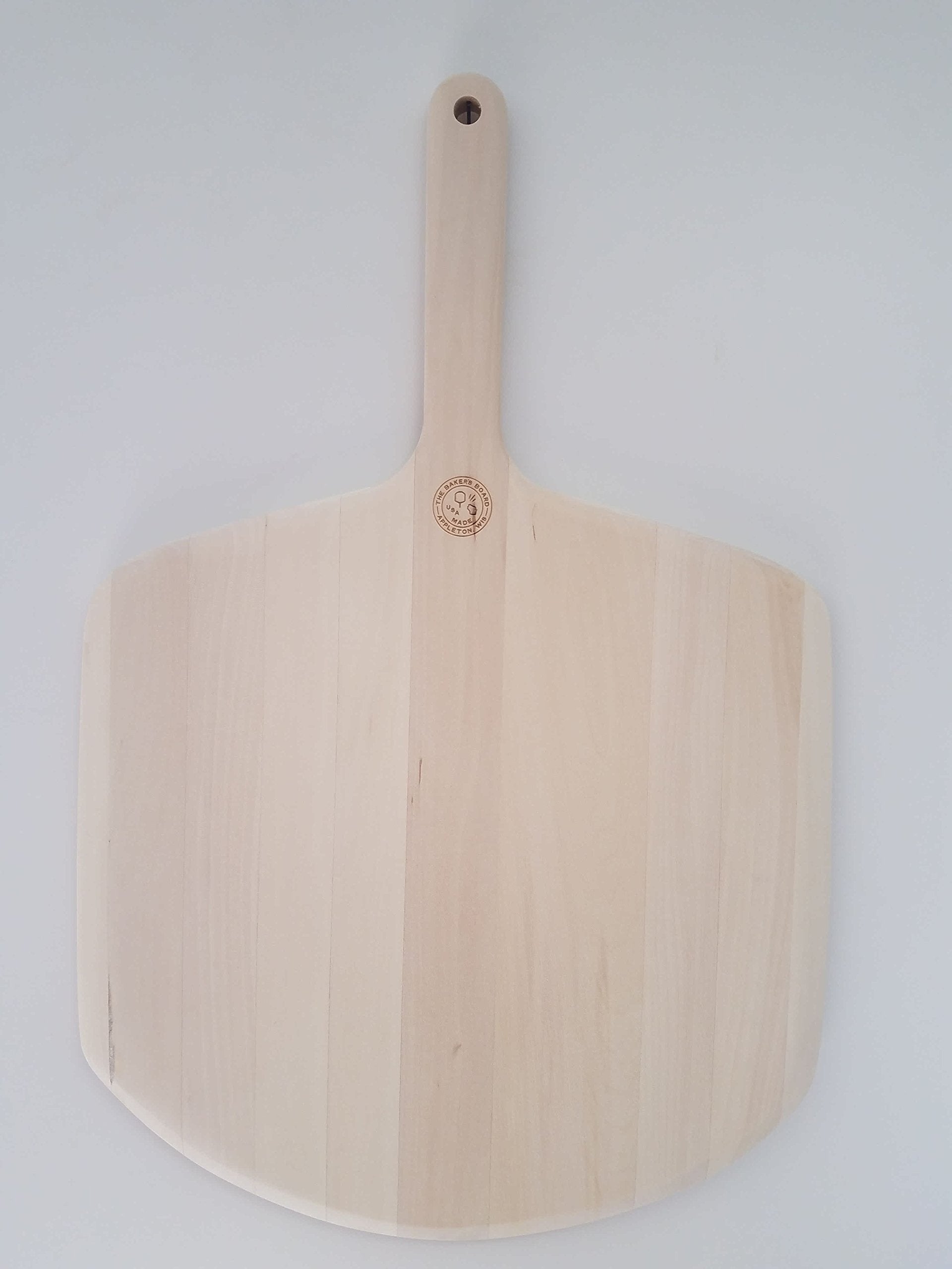 The Baker's Board Pro Perfect Peel, vista lateral, diseño cómodo para manejar la pizza con facilidad.