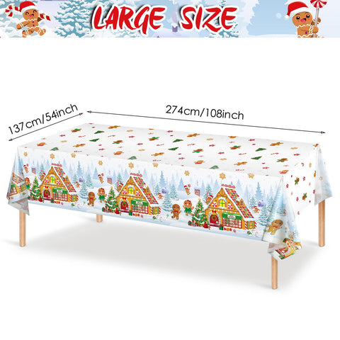 Mantel Tiamon Navidad con casa de jengibre como centro de mesa.