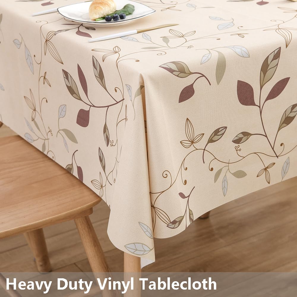 Mantel TruDelve con diseño de hojas beige, ideal para cenas.