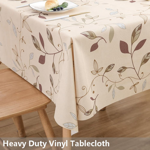 Mantel TruDelve con diseño de hojas beige, ideal para cenas.