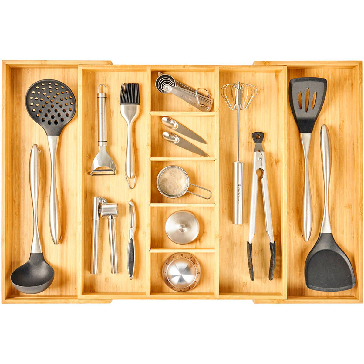 Umilife organizador de cajón expandible en cocina, ideal para utensilios grandes.