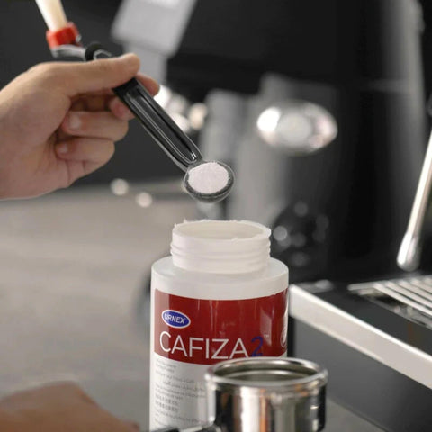 Urnex Cafiza compatibilidad metales NSF, seguro para acero y titanio.