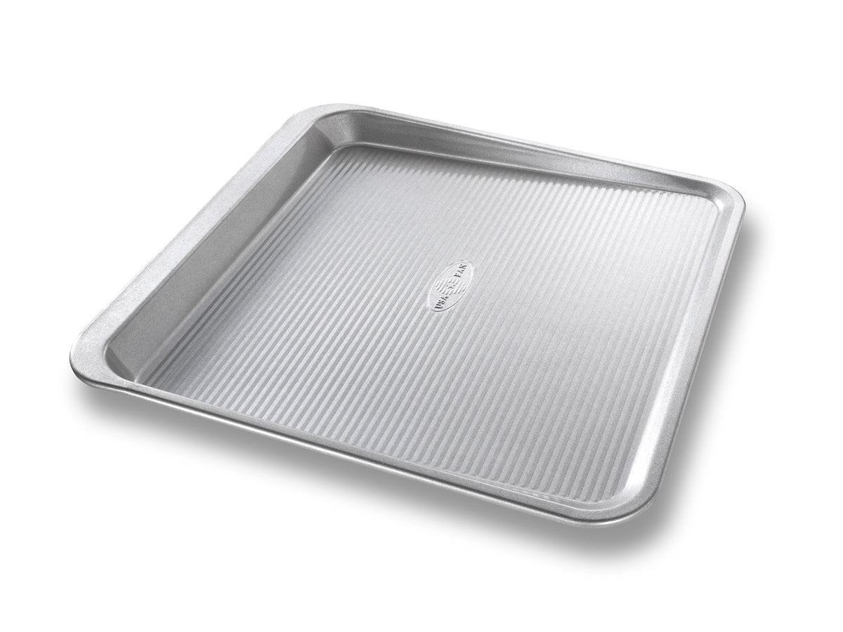 USA Pan: bandeja galletas deslizante para hornear de forma uniforme y fácil de liberar.