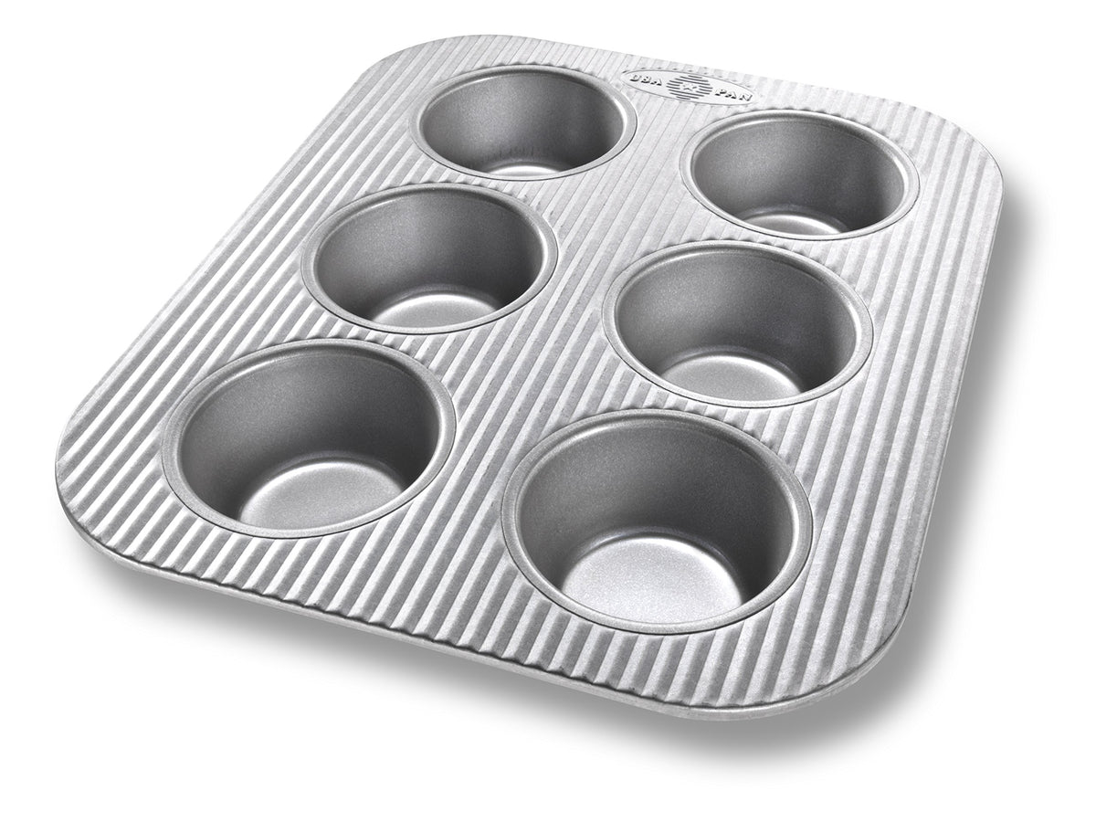 USA Pan bandeja muffin 6 tazas para horno tostador, facilita horneados rápidos y uniformes.
