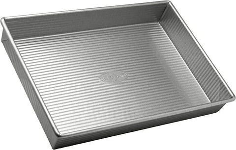 USA Pan: bandeja rectangular 9x13 para hornear pasteles de forma uniforme.