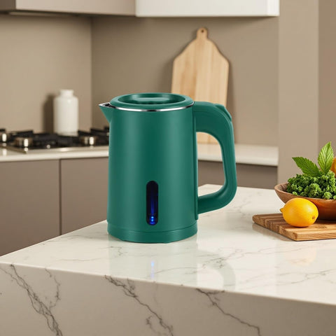 Tetera Wdcme verde, diseño compacto ideal para viaje.