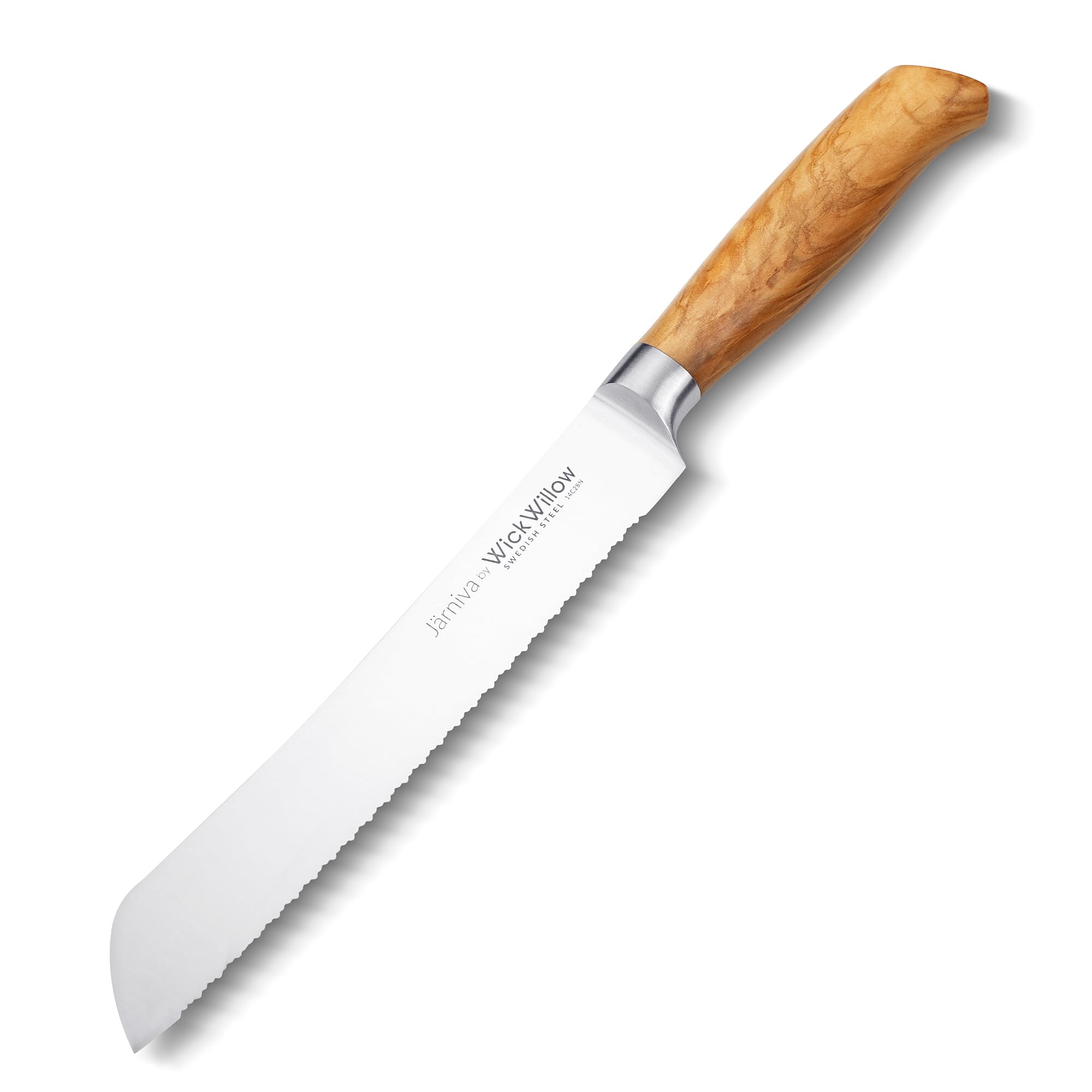 Cuchillo WICKWILLOW en acción cortando frutas y pan en la mesa