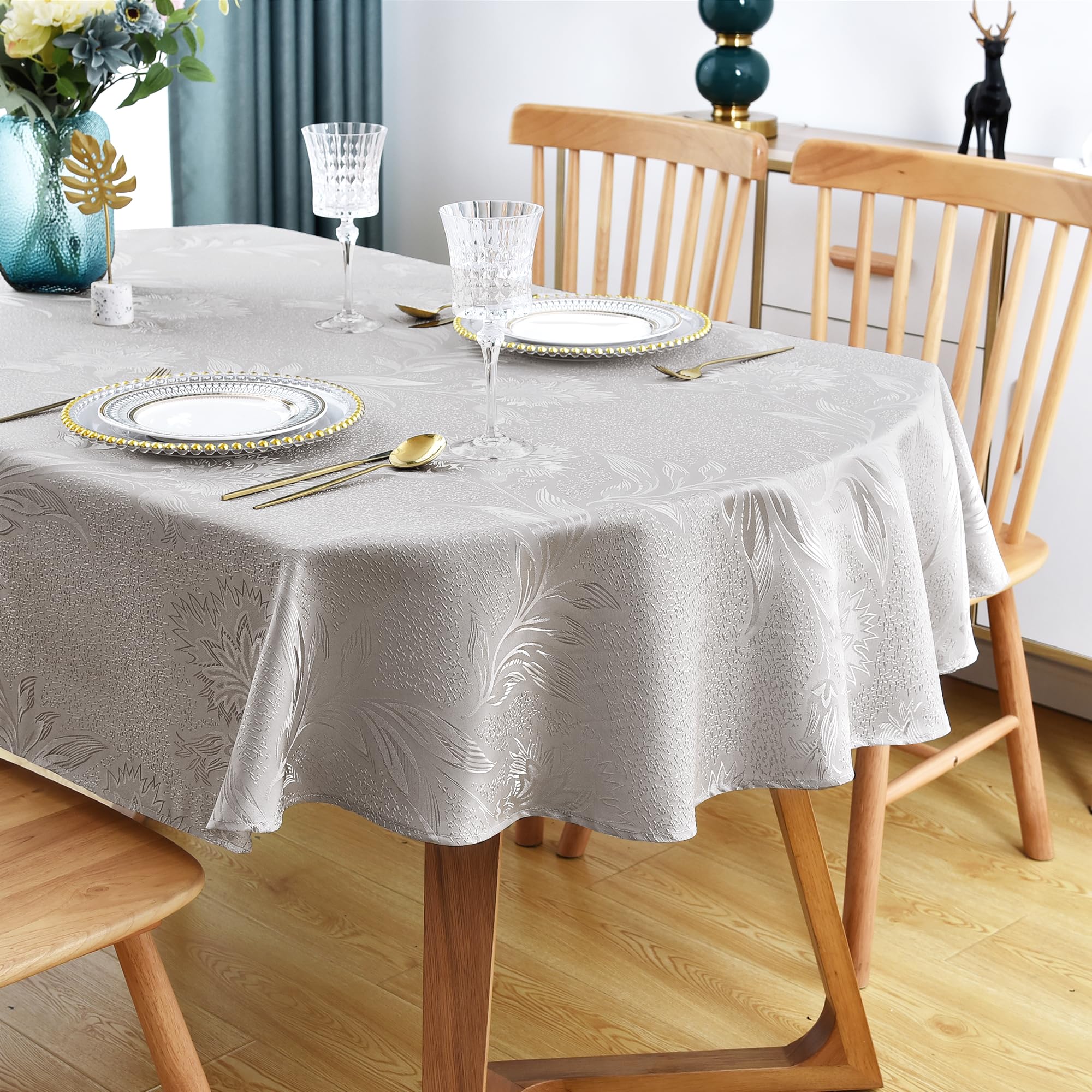 Mantel ovalado Wolkemer con jacquard brillante gris, ideal para cenas elegantes.