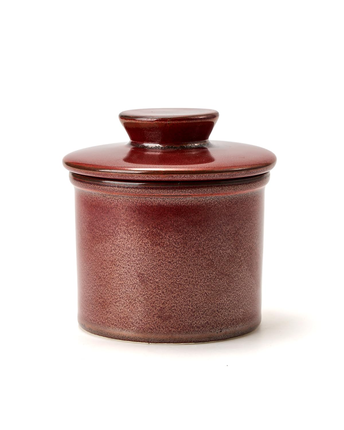 Mantequera de cerámica Xela en encimera, acabado rojizo elegante.