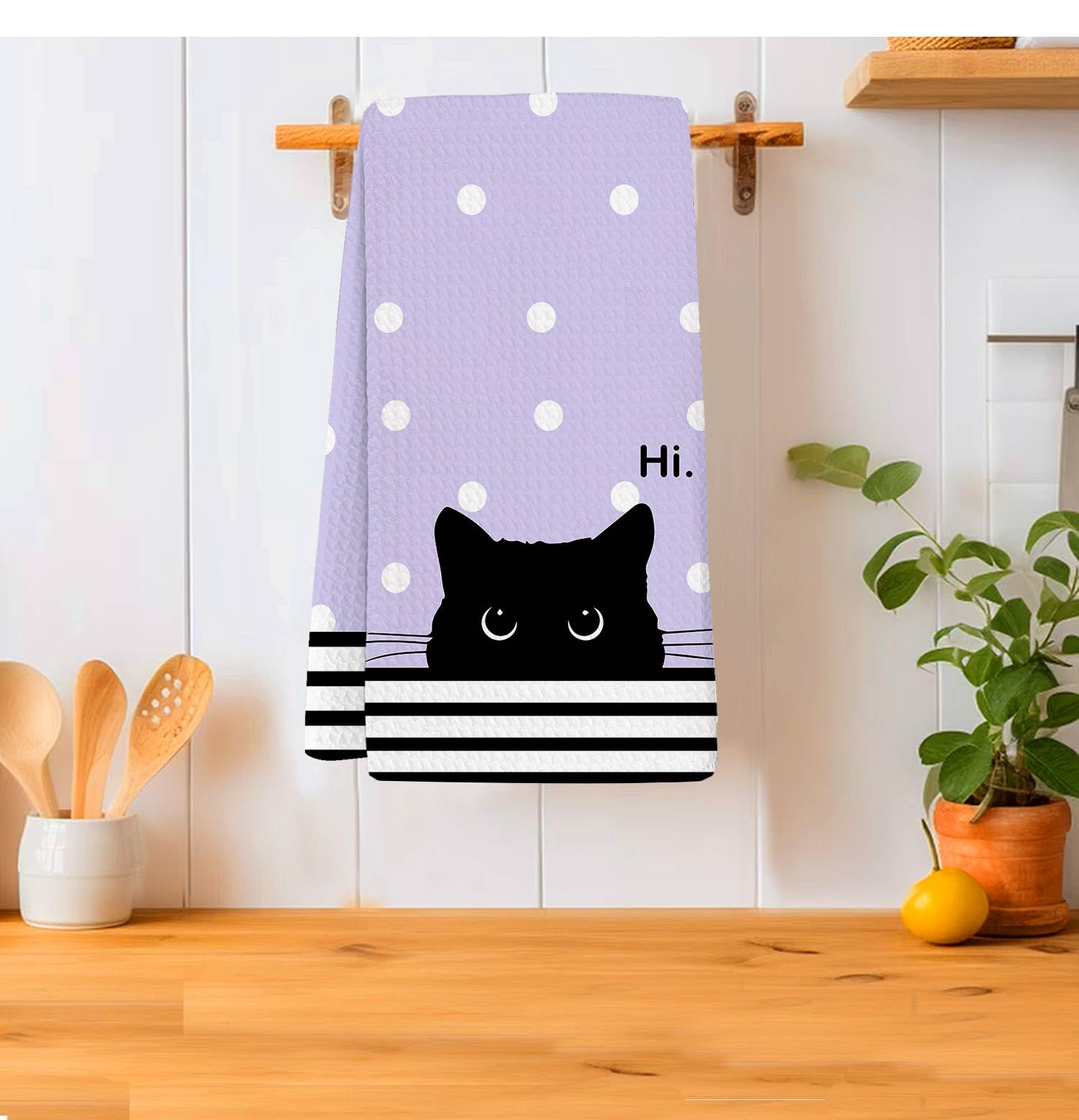 Toallas moradas con diseño de gato para decorar la cocina