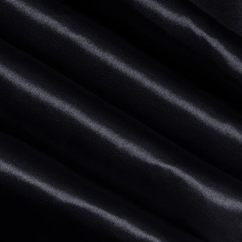 Detalle de brillo satinado en el camino de mesa Yeabwps con textura suave.