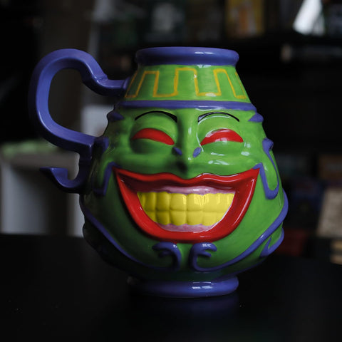 Pot of Greed exhibición: diseño llamativo para tu mesa o estantería.