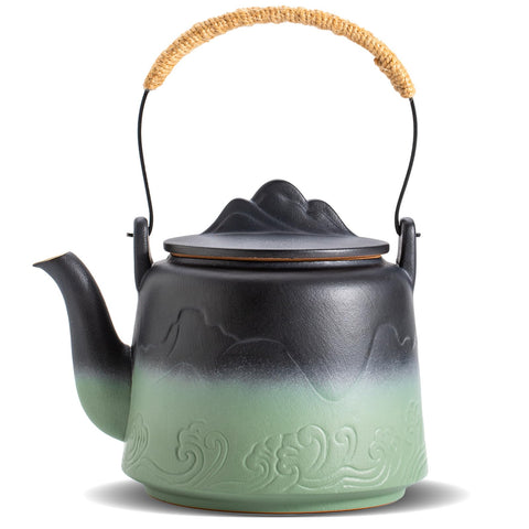 Tetera ZENS con glaseado negro y verde intenso y relieve de montañas, ideal para rituales de té